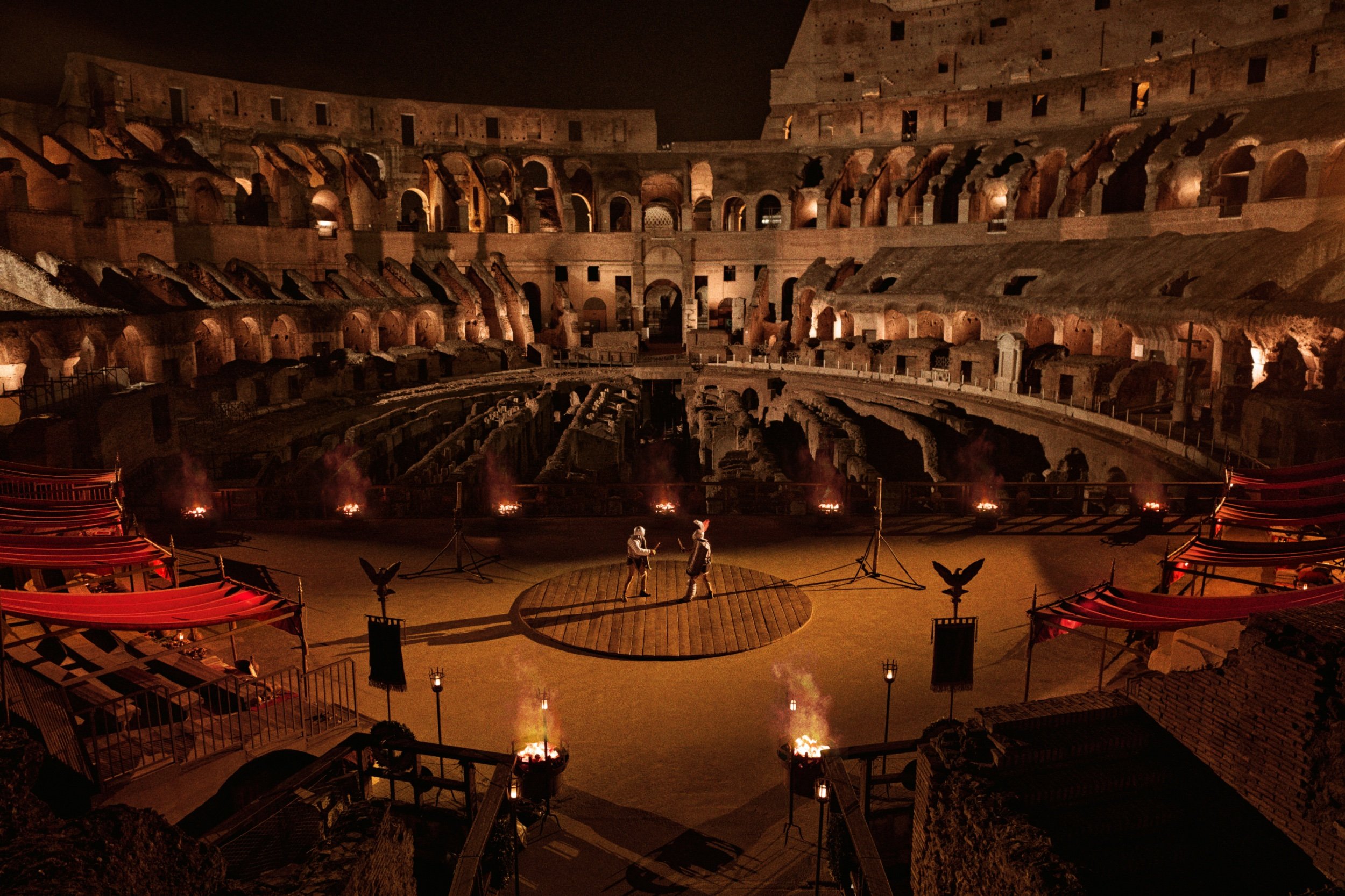 a view of two men fighting inside the colosseum