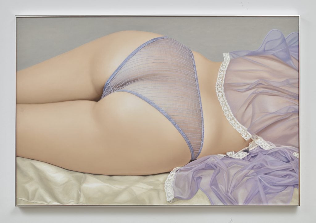 A photograph of a painting by John Kacere depicting the backside of a woman wearing see through lavendar panties and a loose, sheer lavendar top.