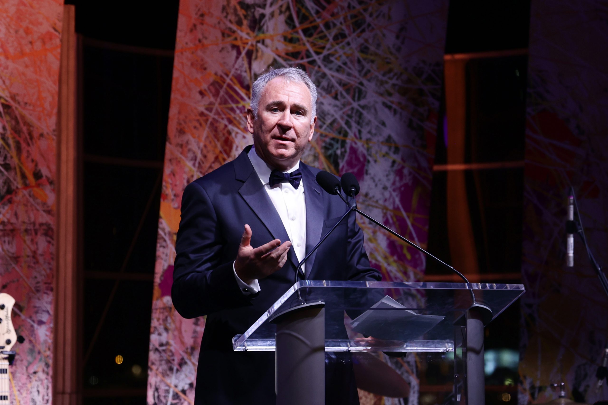 A photograph of Ken Griffin at the podium during The Art of the Party gala at PAMM.