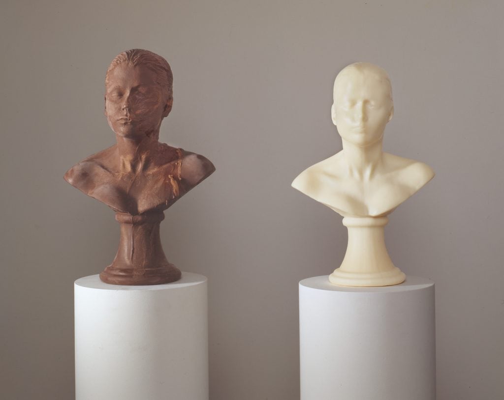 Two sculptures of a woman's bust, in chocolate and soap