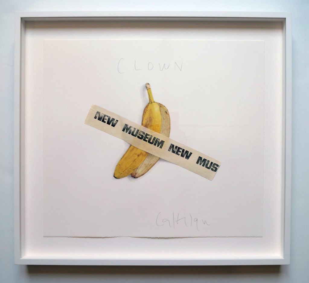 An artwork showing a banana peel on a sheet of white paper with tape reading "New Museum" holding it down