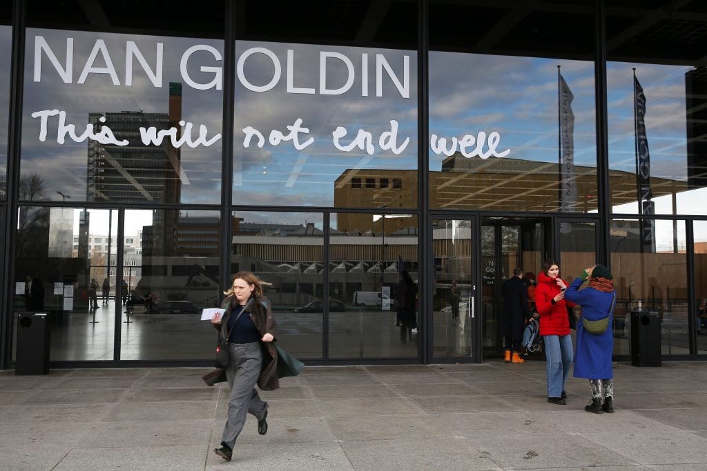 Visitors attend the exhibition "This Will Not End Well" by photographer Nan Goldin at Neue Nationalgalerie, on November 23, 2024 in Berlin.