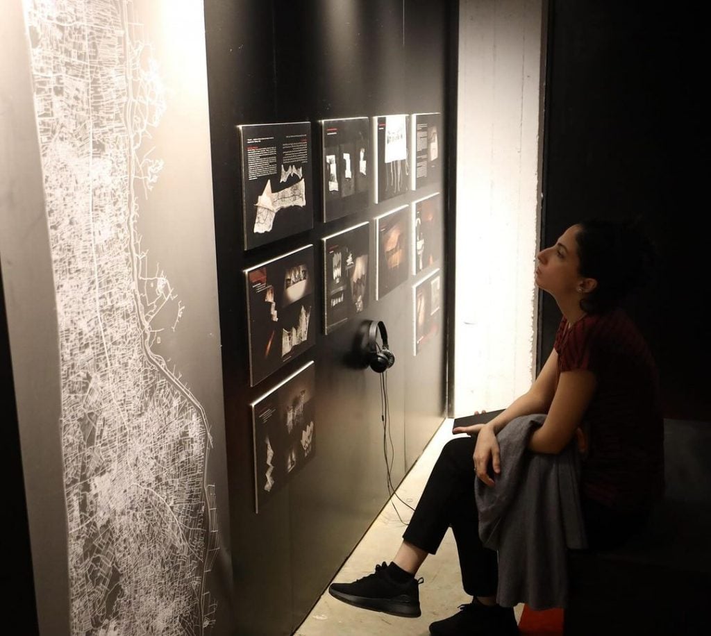 A person is seen viewing an art installation by Palestinian artist Hala Eid Al-Naji, currently on view in Cairo. 