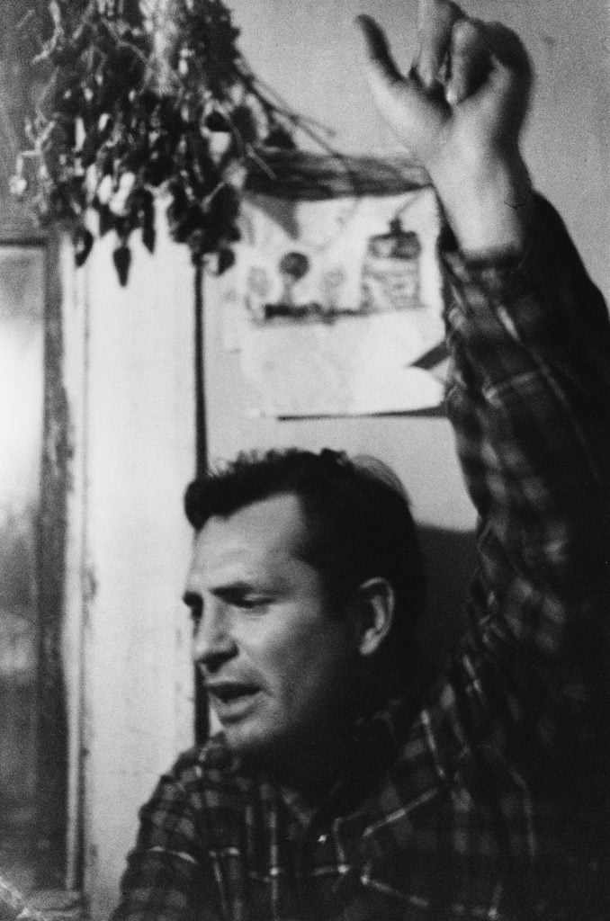 a black and white photo of author Jack Kerouac by robert frank 