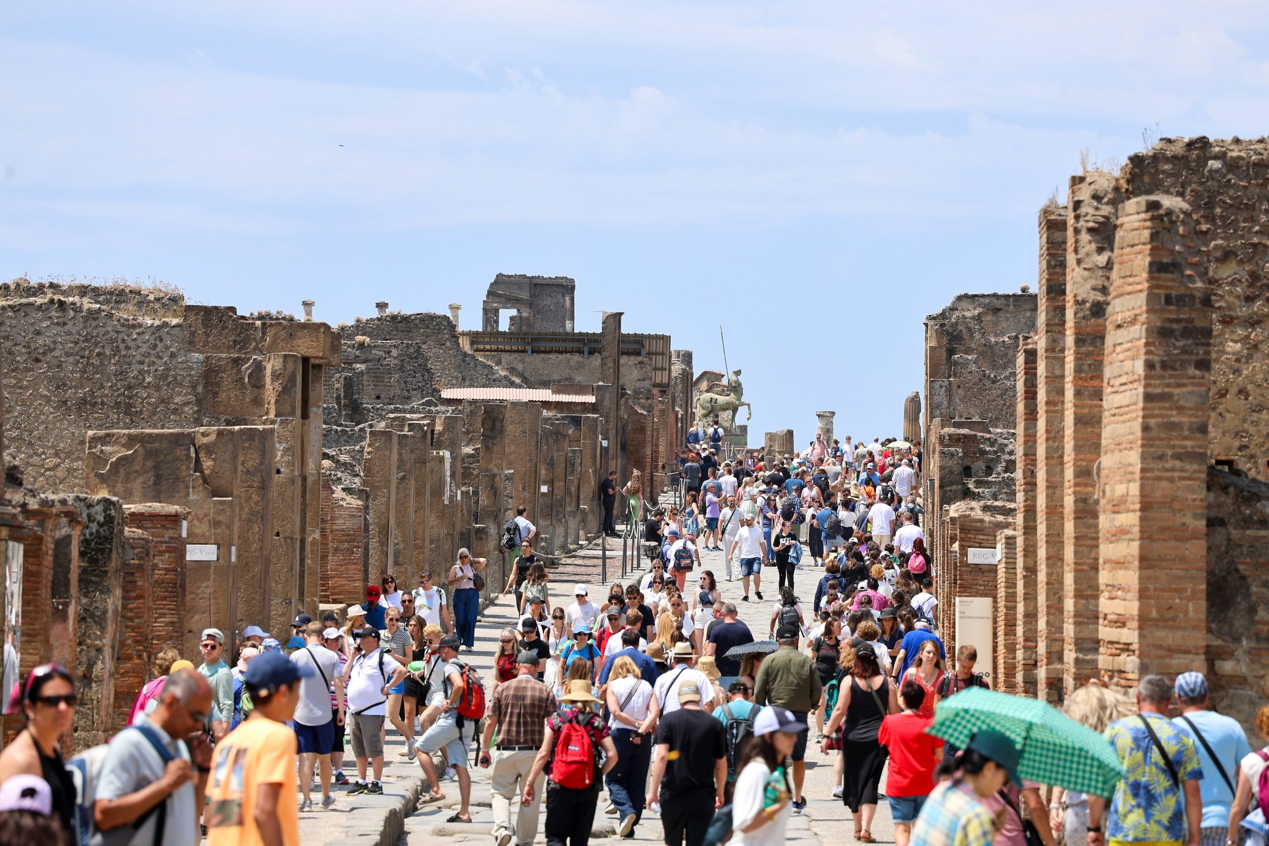 A crowd of tourists on the main street of the Pompeii archaeological excavations. New visitor limitations are being implemented beginning Friday, November 15.