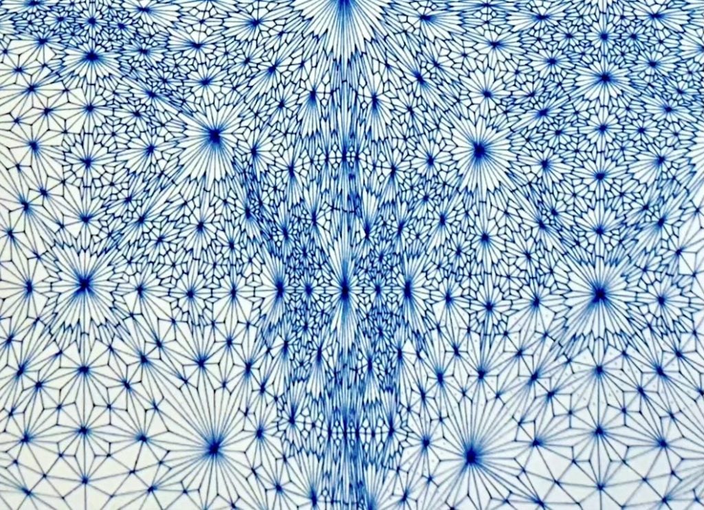 A detail view of a very intricate abstract drawing in blue