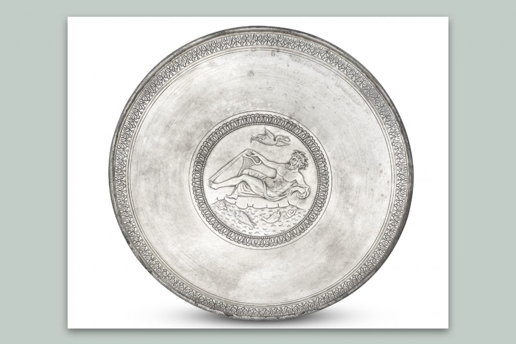 A large Roman silver plate decorated with a River God, circa 3rd century, is re-offered for sale at Bonhams's December 5 antiquities sale in London.