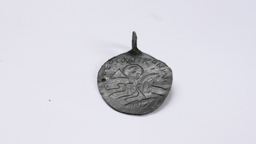 the amulet on a plain white background