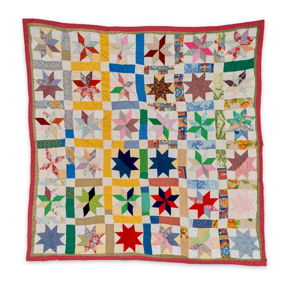 A brightly colored, patterned quilt.