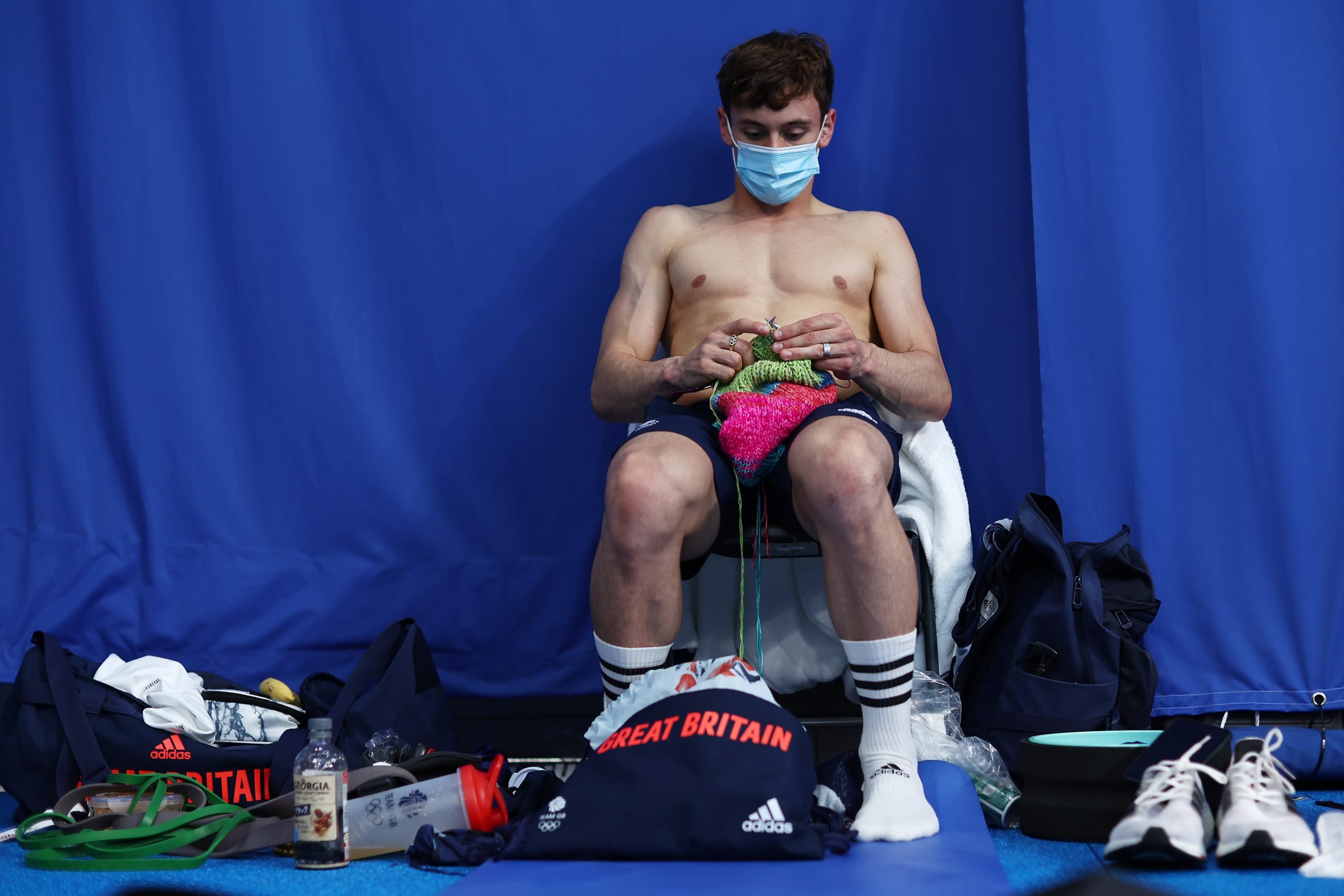 Tom Daley of Team Great Britain is seen knitting before the Men's 10m Platform Final on day fifteen of the Tokyo 2020 Olympic Games in 2021 in Tokyo, Japan.