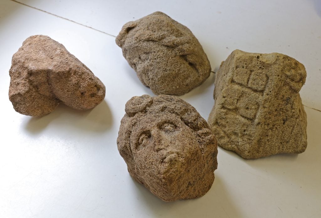 four large pieces found at the Roman villa they are on a white background