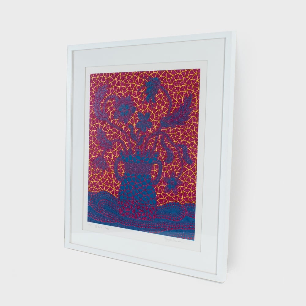 Print by Yayoi Kusama in red and blue of a vase overflowing with flowers, executed in Kusama's signature polka dots.