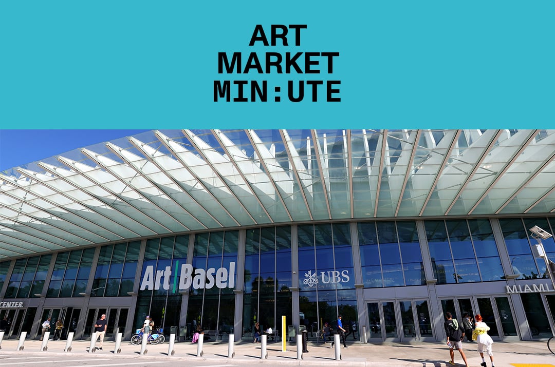 The exterior of Art Basel Miami Beach, showcasing its modern glass architecture, with people walking outside under a clear, sunny sky.