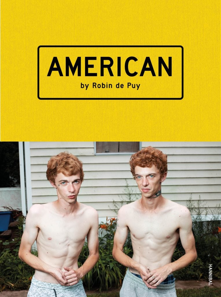 A book cover with ‌an ‍image of ‍two shirtless red-headed boys with pale skin and not⁢ a lot of meat on them ⁣on the cover of a book called AMERICAN