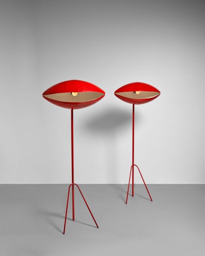 two red lamps on a white wall