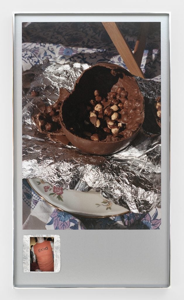 a collage like photo shows a broken plate and a chocolate and a t-shirt with a slogan and is eerily beautiful 