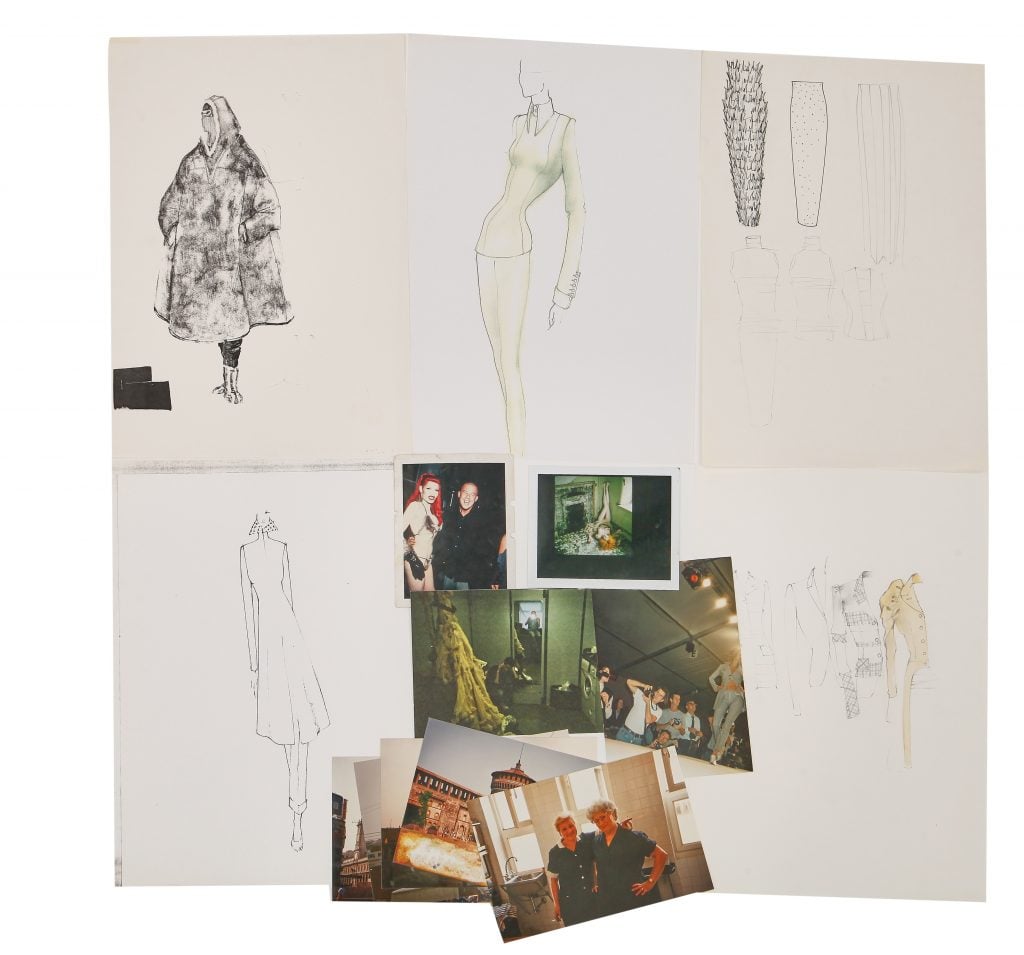 A photograph of six sketchbook pages on a white backgroundm each featuring fashion drawings, except for one in the lower middle, which has a collage of photographs.