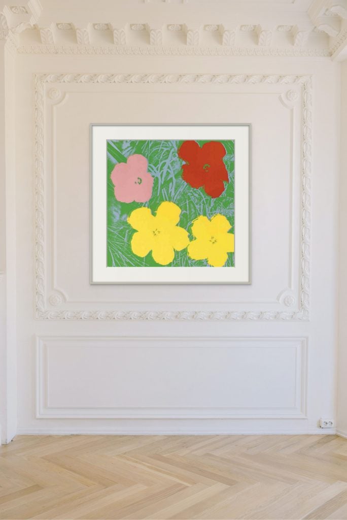 Print by Andy Warhol of four flowers on a green ground installed against a plaster molded wall above a herringbone parquet floor, on offer from Leskovar Fine Art.