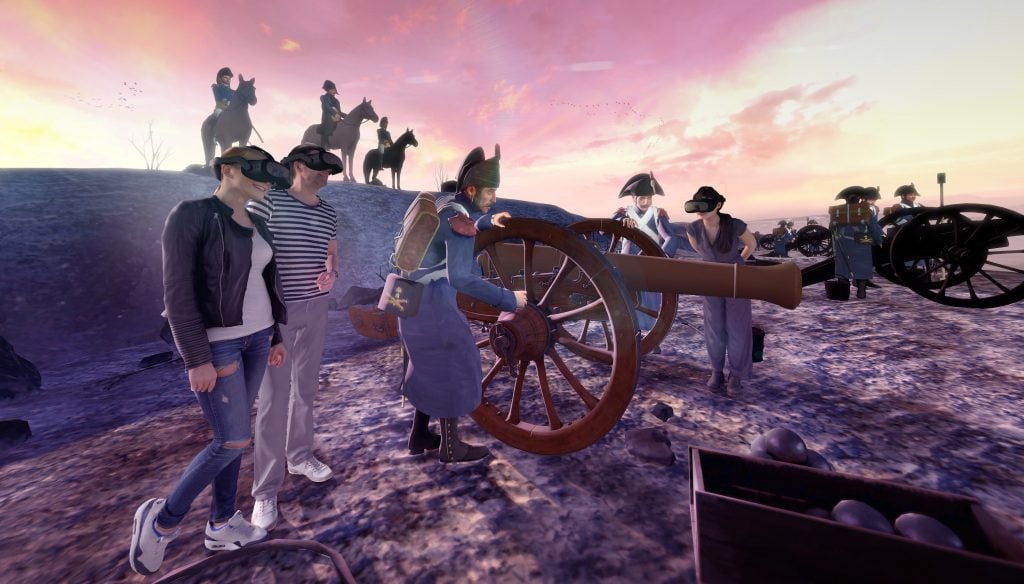 a virtual scene in which two people look at a battle taking place around them