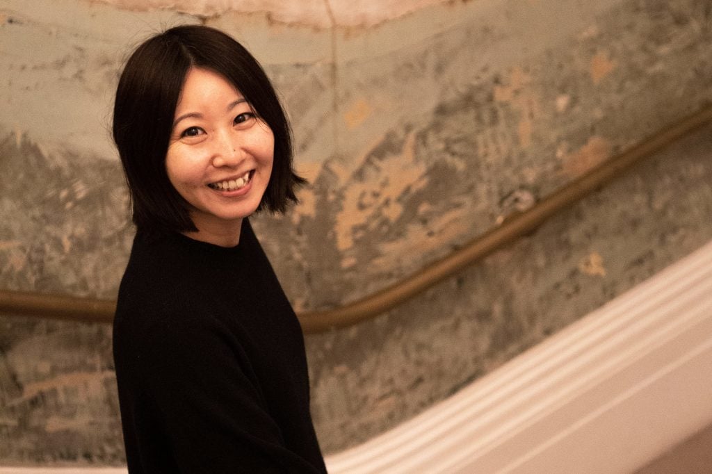 An image of Ayako Rokkaku at Old Sessions House for her live painting with Avant Arte