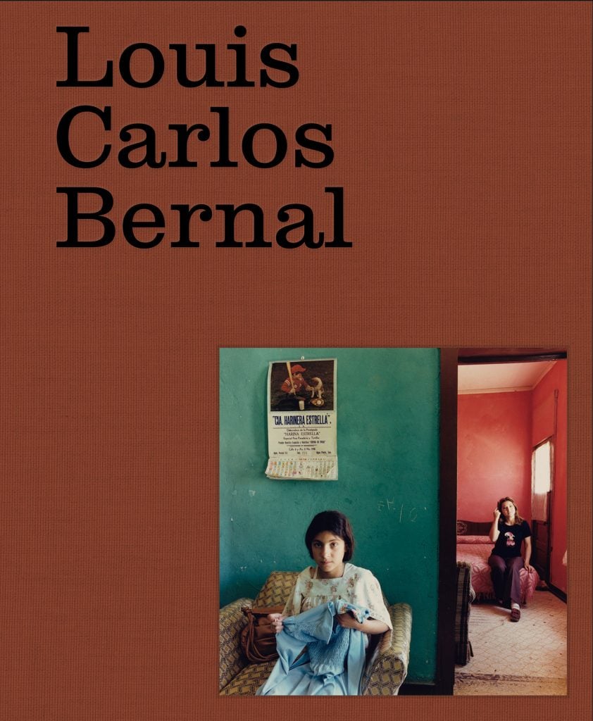 The name Louis Carlos Bernal​ is⁢ seen on the cover of ‍a book ⁤of ⁣the photographer's work with one of his photographs