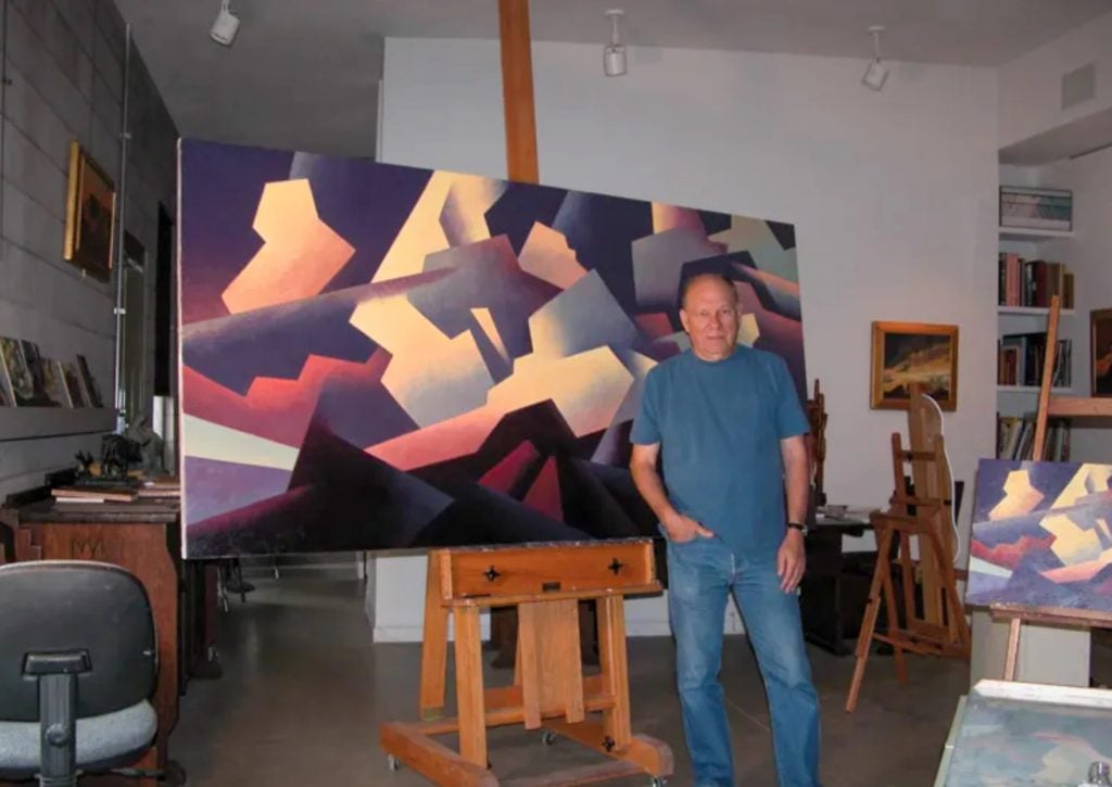 Ed Mell with his landscape painting. 