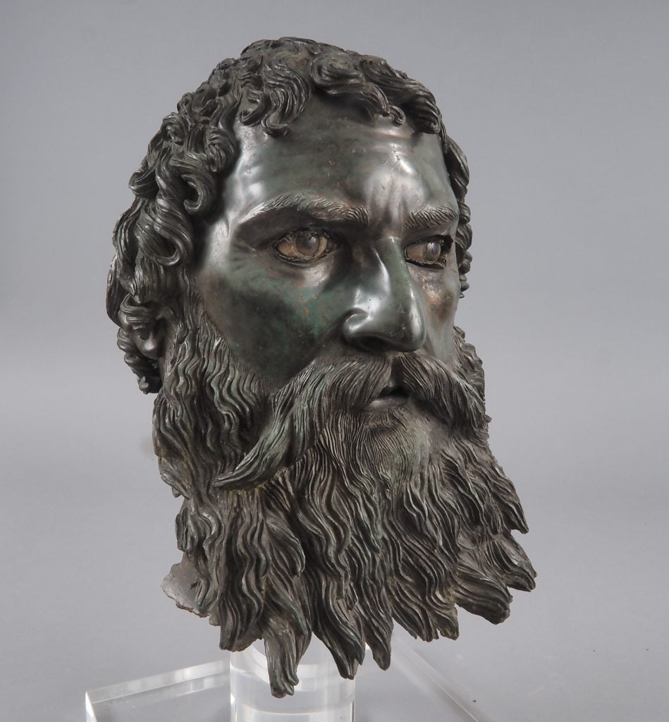 head of a man with beard in a bronze sculpture