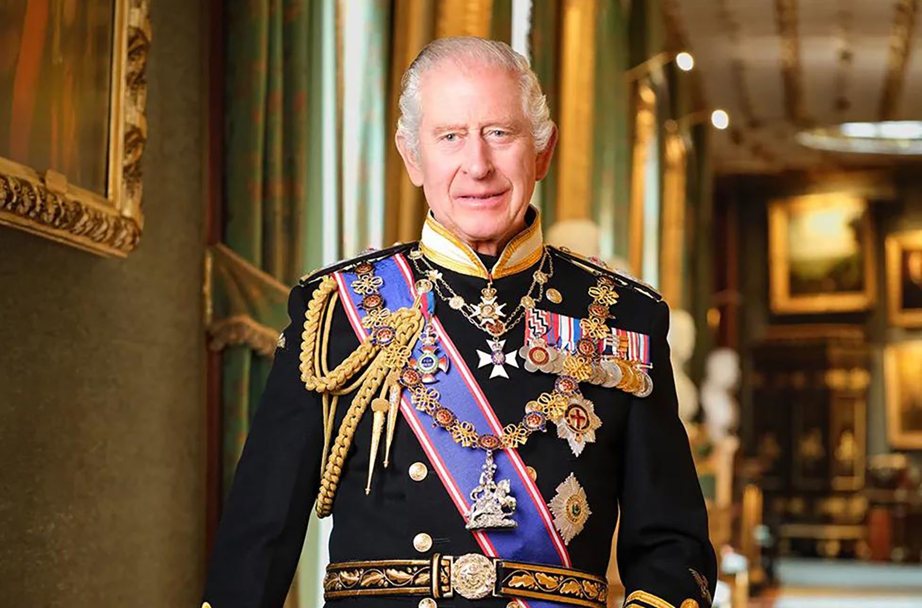 King Charles posing in the Royal Navy uniform in Windsor Castle