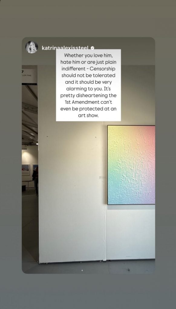 A scrreenshot of an Instagram story depicting a pastel-colored artwork hanging next to an empty space on a wall, with black text imposed on a square white text box above it.