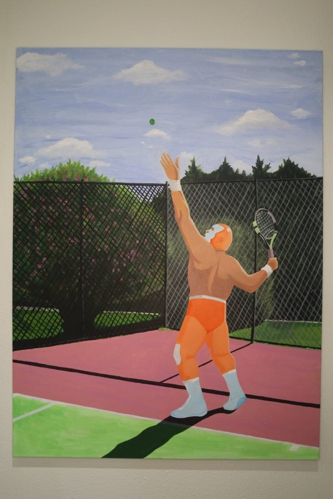 One of professional wrestler Lee Moriarty's lucha libre paintings shown by Orange Crush at NADA Miami Beach. A shirtless wrestler in an orange lucha libre throws up a tennis ball to serve on the court. 