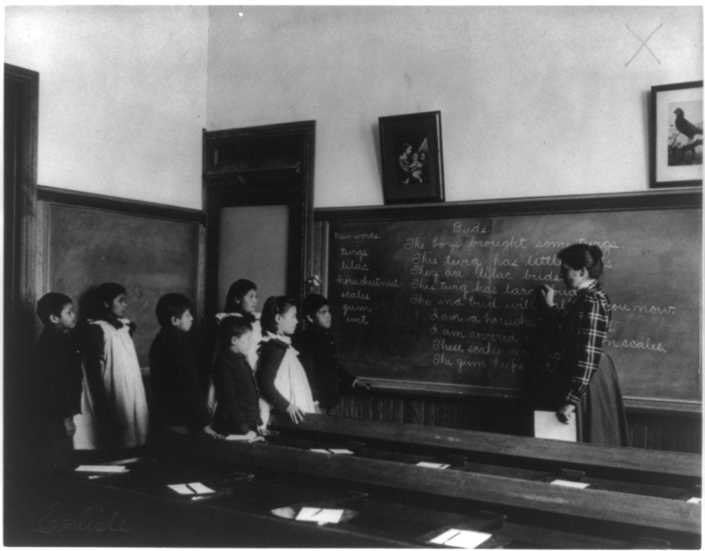 A classroom scene at the notorious Carlisle School in a 1901 cyanotype photograph by Frances Benjamin Johnston. Photo courtesy of the Library of Congress