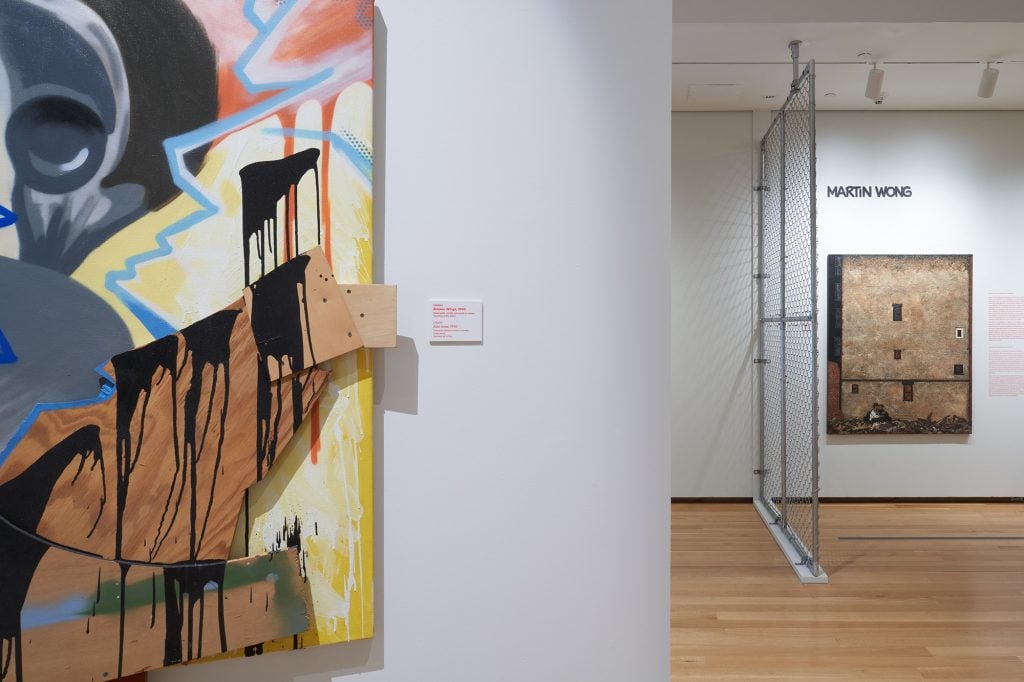 Paintings hanging in the show "Above Ground" at the Museum of the City of New York