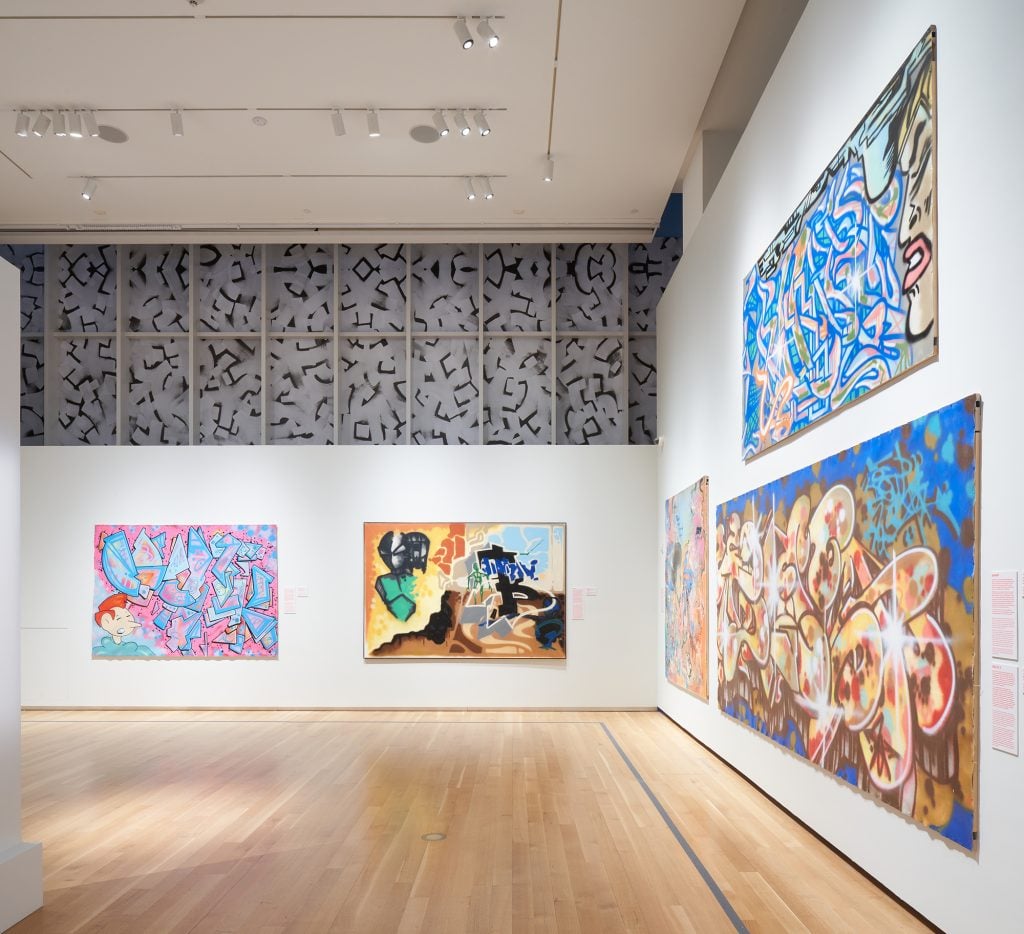 Paintings hanging in the show "Above Ground" at the Museum of the City of New York