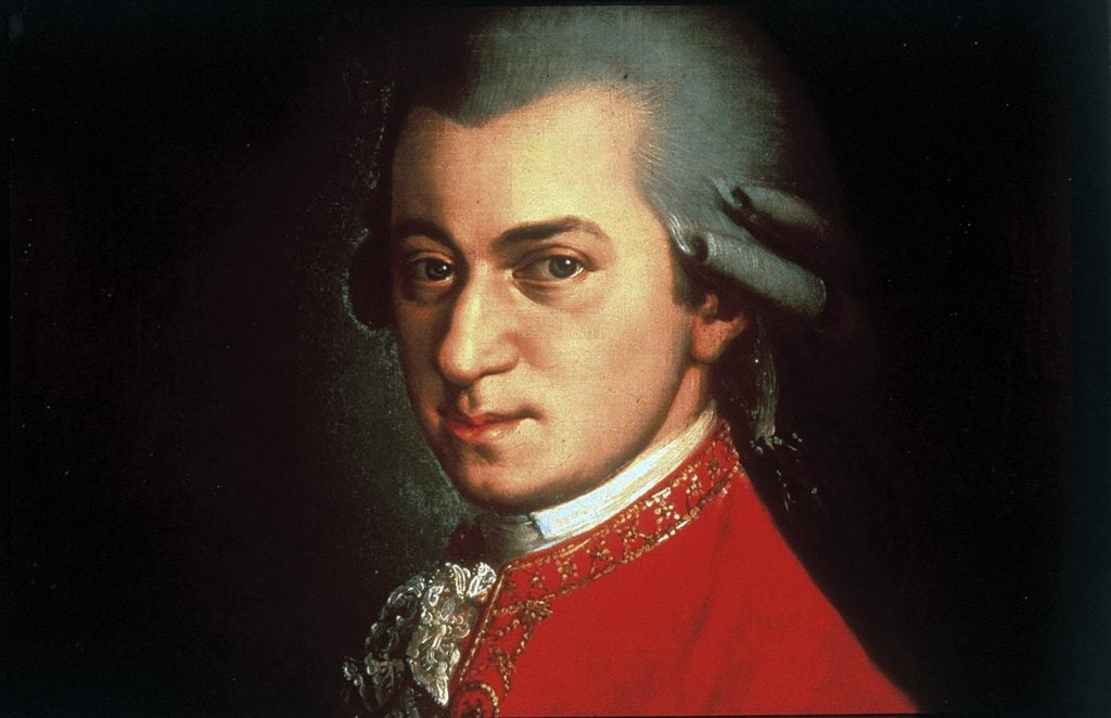 Portrait of Wolfgang Amadeus Mozart in a red coat, showcasing his iconic hairstyle, painted by Croce.