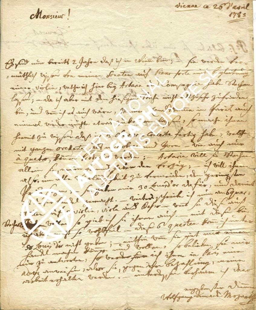 An image of a slightly worn letter written in ink and script by Mozart.