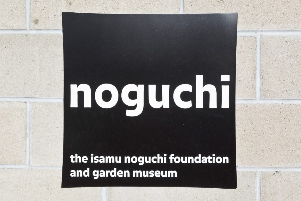 An image of a sign for the Isamu Noguchi Foundation and Garden Museum in Long Island City, New York.