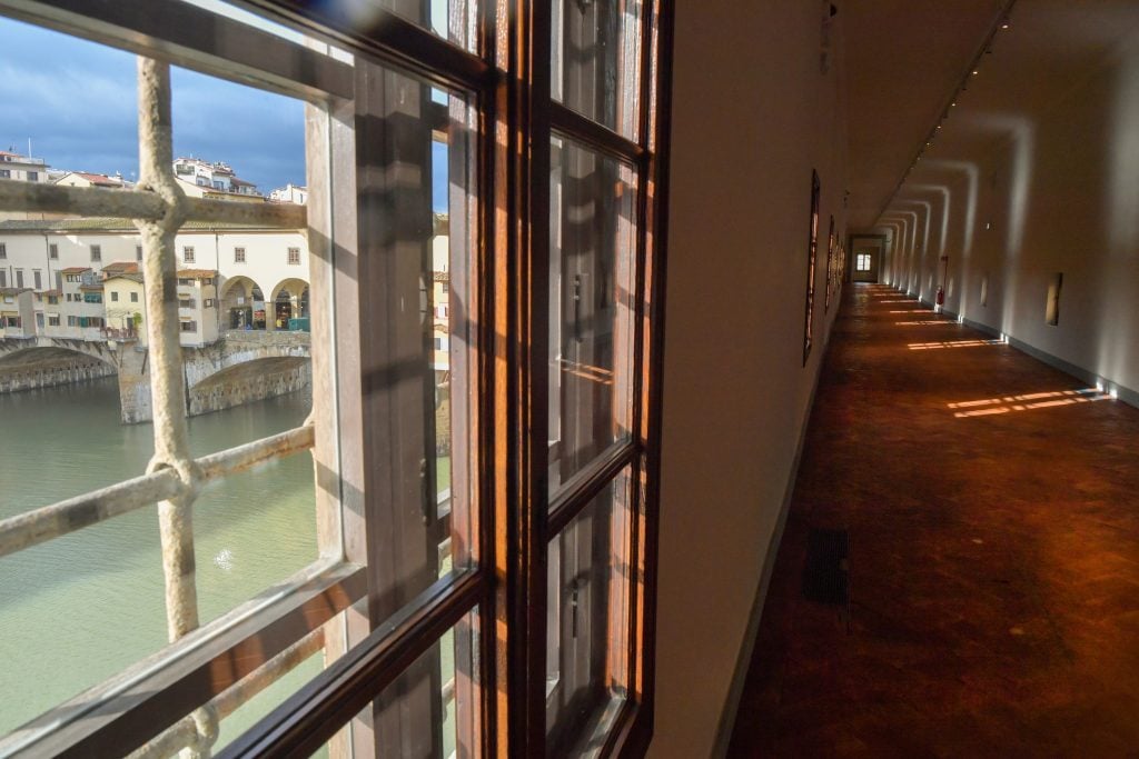 a view through a window of the Vasari Corridor