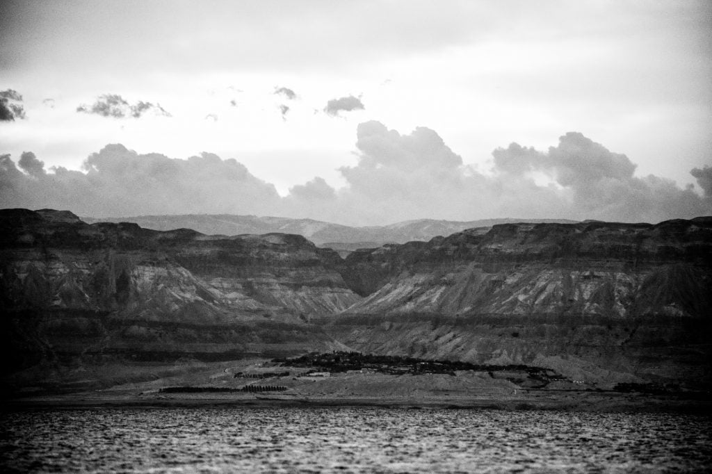 a black and white photo of a majestic rocky landscape