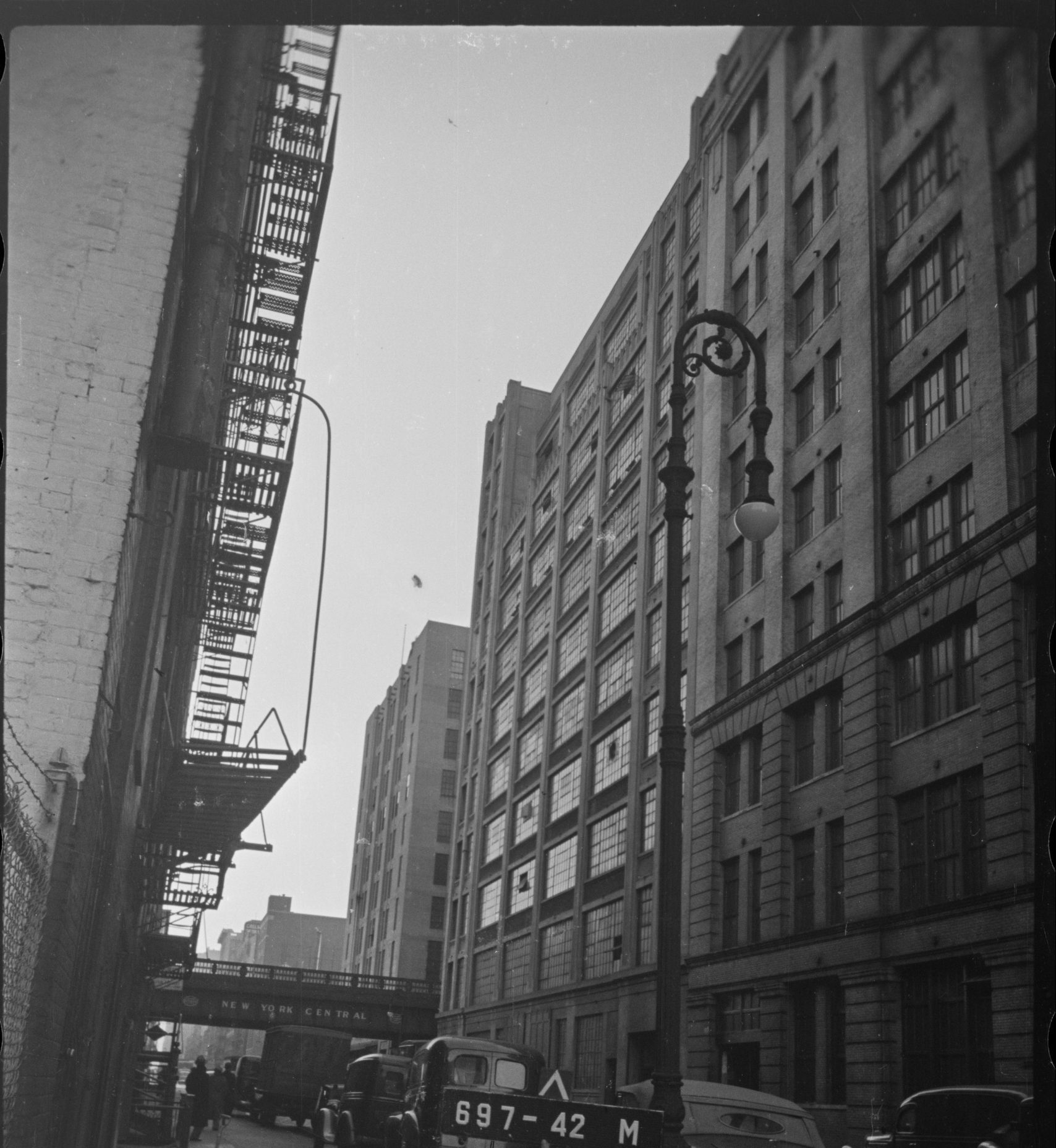 A black-and-white photo shows a tall building