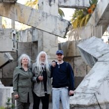 Artist Armand Vaillancourt and his wife and son stand before his monumental sculpture in San Francisco's Embarcadero Plaza