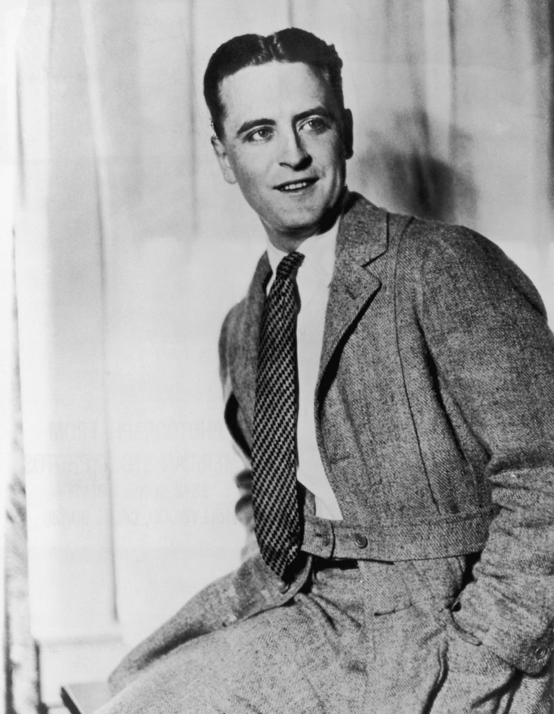 a black-and-white photograph of a white man in a day suit, circa the 1920s