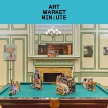 a series of small ceramic artworks displayed on a pool table in an ornately decorated period room