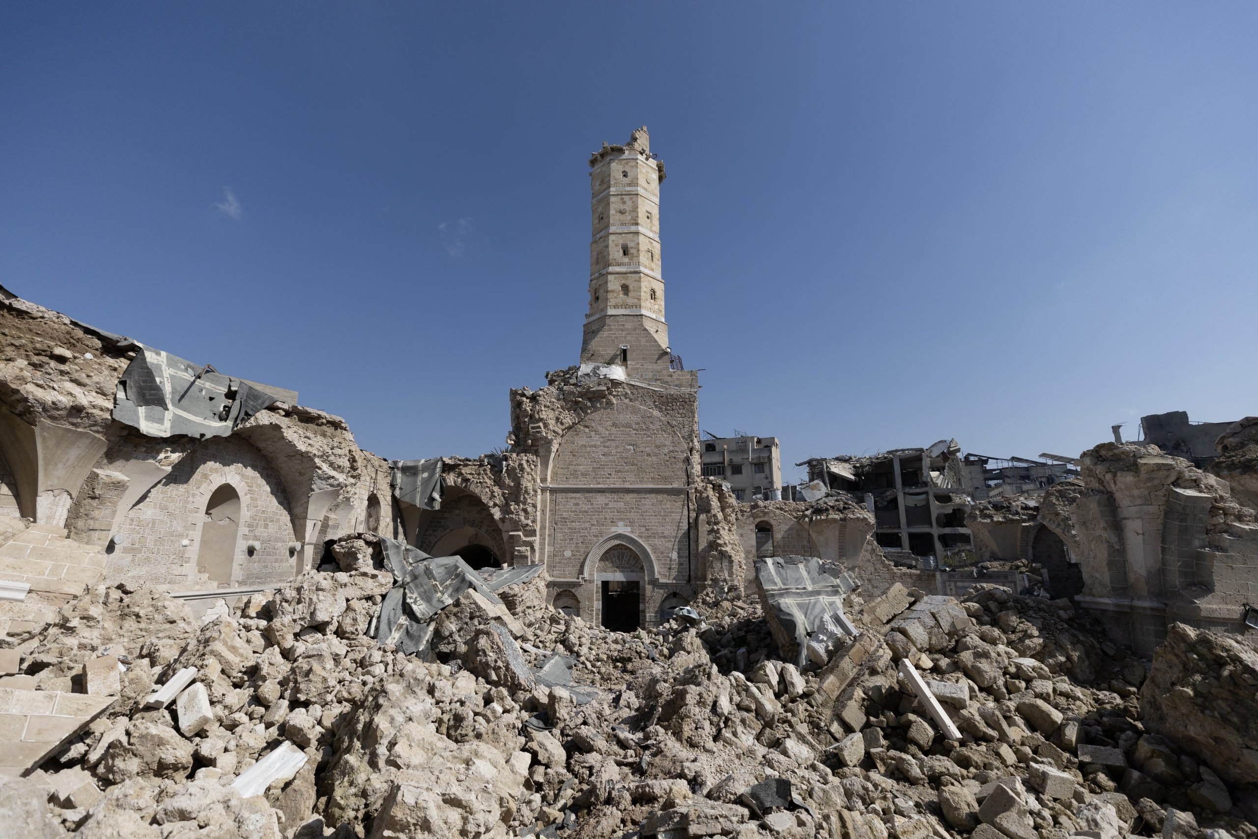 The remains of the Great Omari Mosque in Gaza, showing its collapsed structure and the historic minaret still standing amid heavy destruction.