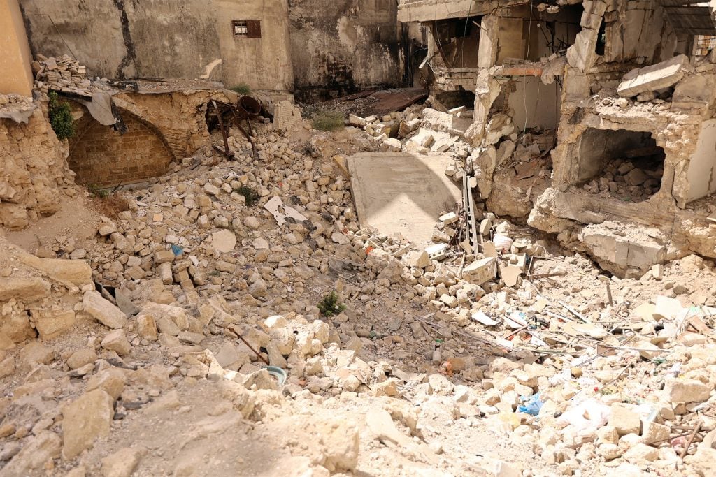 Rubble and collapsed buildings, showing the impact of bombing and destruction in Gaza’s urban areas.