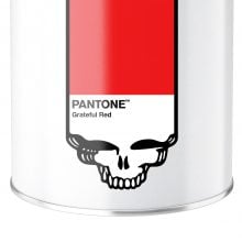 White candle container with a red Pantone color swatch labeled “Grateful Red,” featuring a black skull graphic along the bottom edge.