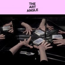 Hands reaching toward playing cards on a reflective surface, mirrored multiple times