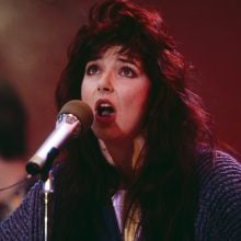 a woman singing into a microphone