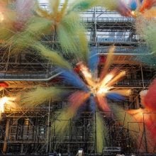 Explosive colorful fireworks installation outside the Centre Pompidou, Paris, combining art and pyrotechnics in a large-scale contemporary performance.