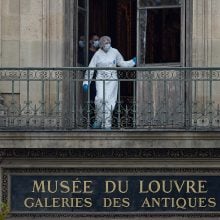 an image of an officer at the site of the Louvre break in