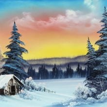 A painting by Bob Ross shows a winter landscape with a cottage and pine trees, the sky lit pink and yellow